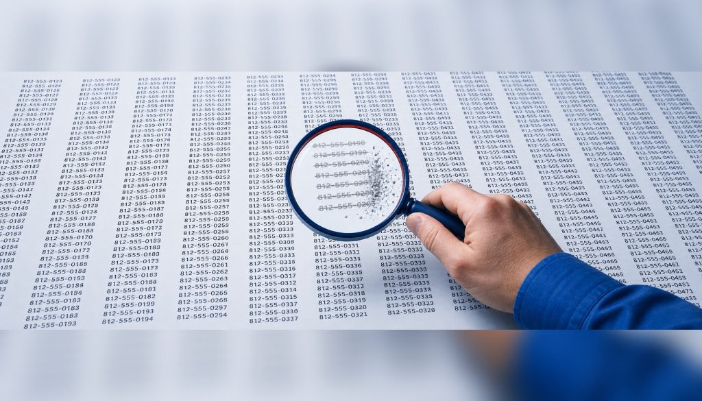Magnifying glass over a large printed telemarketing list revealing faded and crossed-out phone numbers